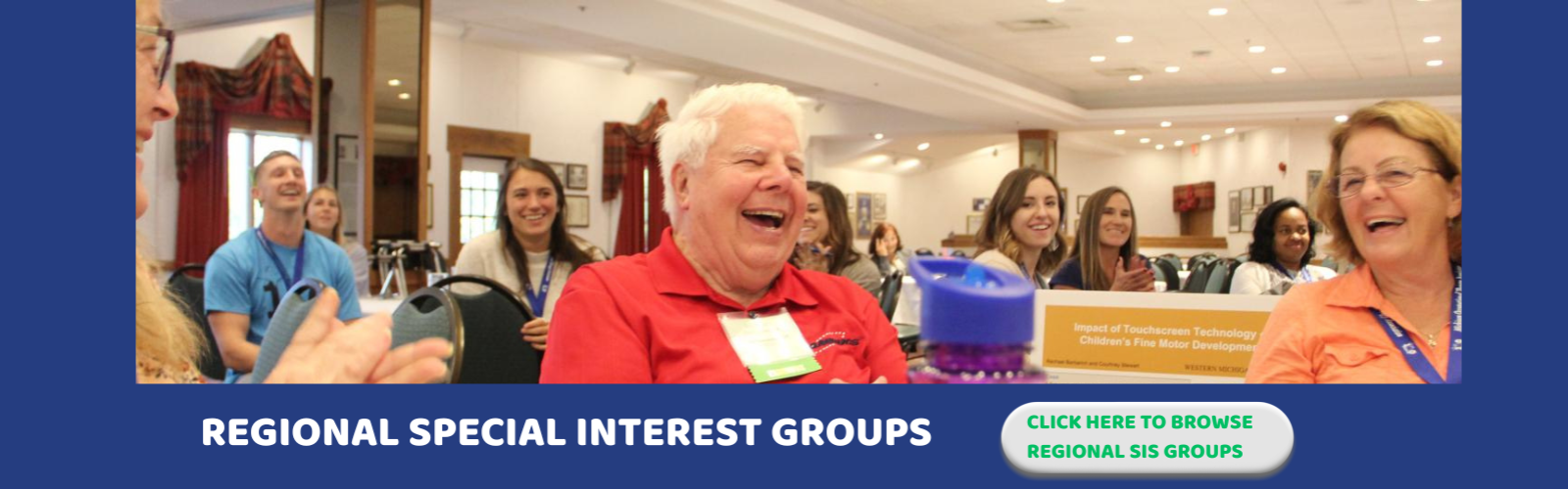 Alt text: Crowd smiling at MiOTA Conference